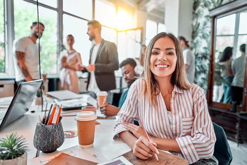 f.hubspotusercontent40.nethubfs157743smiling-female-employee-sit-in-coworking-space-and-working-on-the-picture-id1283955441-jpg-1